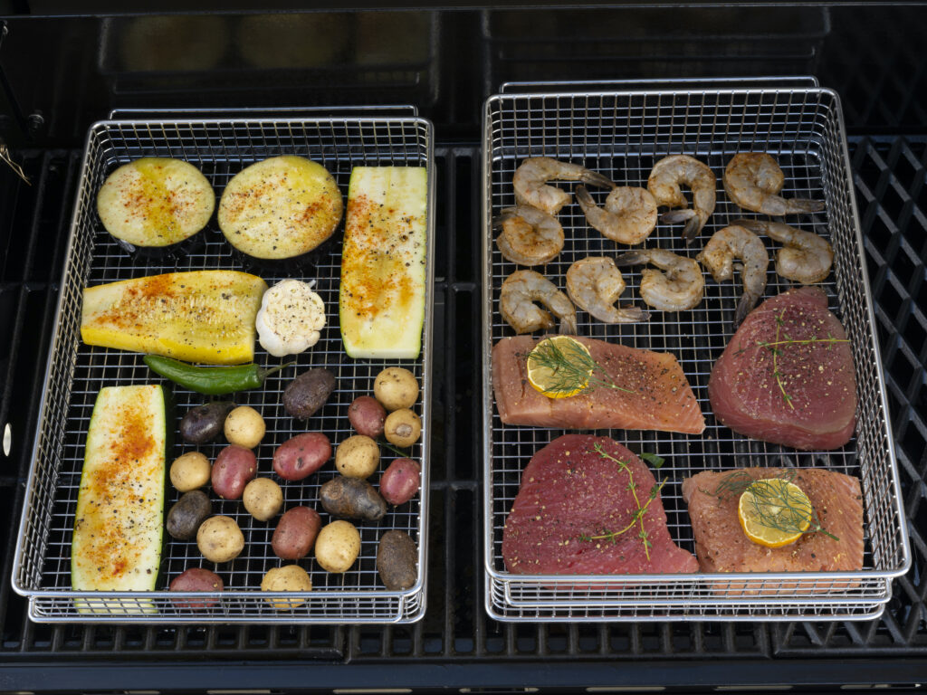 Mixed seafood and veggies on the grill in Basquettes